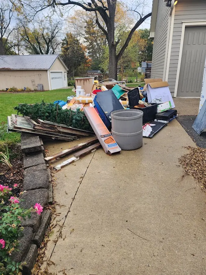 Dumpster being loaded with debris for Commercial Dumpster Rental in Hillsboro